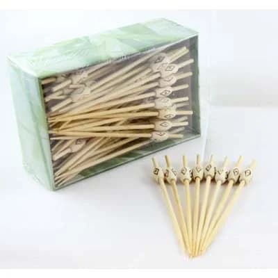 Wooden pick with carved wooden bead