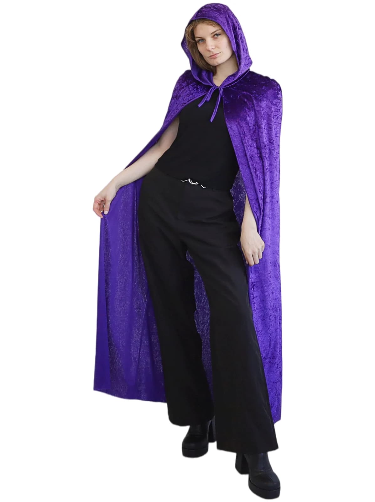 Woman wearing a purple hooded velvet cape tied at the neck, front view