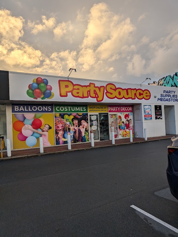 Party Source storefront at golden hour